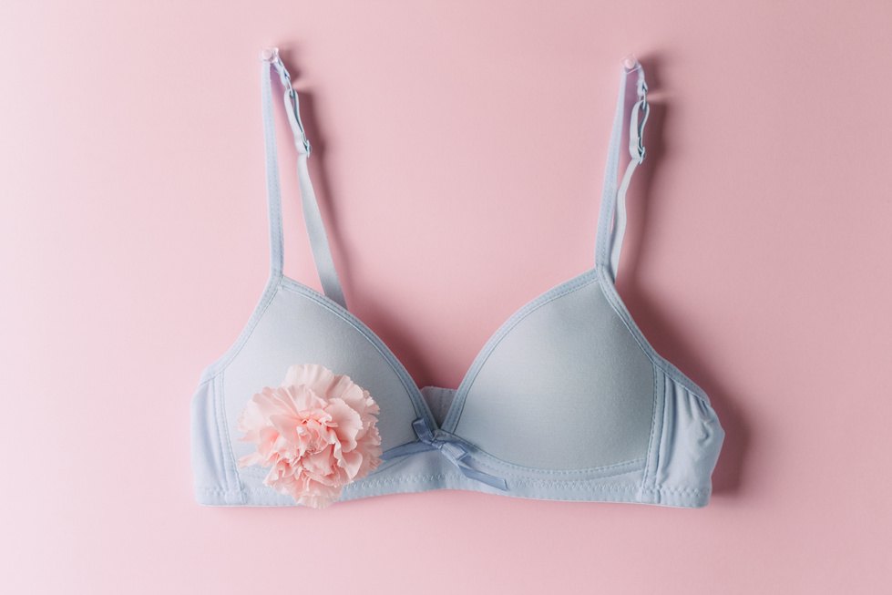 A light blue bra with a pink flower